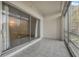 Bright lanai with tile flooring and sliding glass doors at 700 Melrose Ave # K32, Winter Park, FL 32789
