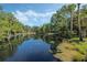 Serene pond with lush landscaping, offering a peaceful community view at 700 Melrose Ave # K32, Winter Park, FL 32789