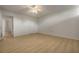 Bedroom with wood-look floors and bathroom access at 700 Melrose Ave # K32, Winter Park, FL 32789