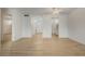 Living room features wood-look floors and access to other rooms at 700 Melrose Ave # K32, Winter Park, FL 32789