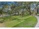 Expansive grassy area with mature trees, providing a tranquil setting at 700 Melrose Ave # K32, Winter Park, FL 32789