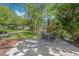 Relaxing patio area with table, chairs and pond view at 700 Melrose Ave # K32, Winter Park, FL 32789