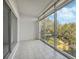 Spacious lanai with sliding glass doors and treetop views at 700 Melrose Ave # K32, Winter Park, FL 32789