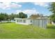 Backyard with grassy area and rusty metal screen at 1338 Vassar St, Orlando, FL 32804