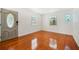 Bright living room with hardwood floors and stained-glass window at 1338 Vassar St, Orlando, FL 32804