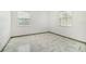 Simple bedroom with new tile floors and neutral walls at 1338 Vassar St, Orlando, FL 32804