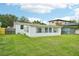 White house with large windows and grassy lawn at 1338 Vassar St, Orlando, FL 32804