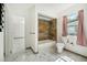 Updated bathroom with tile shower/tub combo and pedestal sink at 1338 Vassar St, Orlando, FL 32804