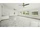 Bright and airy bonus room with multiple windows and ceiling fans at 1338 Vassar St, Orlando, FL 32804
