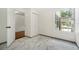Well-lit bedroom with tile floors, closet, and window at 1338 Vassar St, Orlando, FL 32804