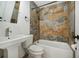 Updated bathroom with a tub and shower combination at 1338 Vassar St, Orlando, FL 32804