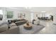 Bright living room with L-shaped sofa, coffee table, and view into dining area at 1338 Vassar St, Orlando, FL 32804