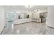Open concept kitchen with stainless steel appliances and breakfast bar at 1338 Vassar St, Orlando, FL 32804
