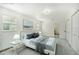 Virtually staged bedroom with a queen bed and ensuite bathroom access at 1338 Vassar St, Orlando, FL 32804