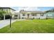 Charming single-story home with a carport and well-maintained lawn at 1338 Vassar St, Orlando, FL 32804