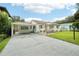 White single-story house with carport and landscaped front yard at 1338 Vassar St, Orlando, FL 32804