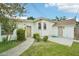 Home's exterior featuring a side yard and walkway at 1338 Vassar St, Orlando, FL 32804