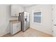 Bright kitchen with granite countertops and gray cabinets at 332 Charles Dr, Deland, FL 32724