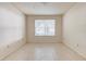 Bright bedroom with large window and tile flooring at 823 Camargo Way # 101, Altamonte Springs, FL 32714