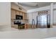 Kitchen with breakfast bar and stainless steel appliances at 823 Camargo Way # 101, Altamonte Springs, FL 32714