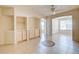 Living room with tile floors, ceiling fan and built-in shelving at 823 Camargo Way # 101, Altamonte Springs, FL 32714