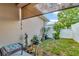 Small backyard with patio furniture and shade cover at 1624 Hawksbill Ln, Saint Cloud, FL 34771