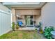 Small backyard with patio furniture and shade cover at 1624 Hawksbill Ln, Saint Cloud, FL 34771