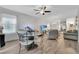 Dining area with glass table and four chairs, near living room at 1624 Hawksbill Ln, Saint Cloud, FL 34771