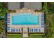 Community pool with plenty of lounge chairs at 1624 Hawksbill Ln, Saint Cloud, FL 34771
