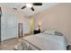 Simple bedroom with a double bed and ceiling fan at 1624 Hawksbill Ln, Saint Cloud, FL 34771