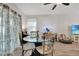 Small dining area with glass table and four chairs at 1624 Hawksbill Ln, Saint Cloud, FL 34771