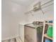 Laundry room with washer, dryer, and shelving at 1624 Hawksbill Ln, Saint Cloud, FL 34771