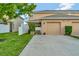 Attached garage with driveway and landscaping at 1624 Hawksbill Ln, Saint Cloud, FL 34771