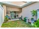 Small backyard with patio furniture and shade cover at 1624 Hawksbill Ln, Saint Cloud, FL 34771