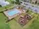 Community pool with playground and lounge chairs at 1624 Hawksbill Ln, Saint Cloud, FL 34771