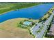 Community pool, playground, and lake view at 1624 Hawksbill Ln, Saint Cloud, FL 34771