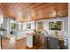 Open concept dining area with hardwood floors and a rustic wooden table at 1205 Sutton Trl, Geneva, FL 32732