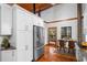 Modern kitchen with stainless steel appliances and white cabinets at 1205 Sutton Trl, Geneva, FL 32732