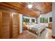 Large main bedroom with wood flooring, a ceiling fan, and ample closet space at 1205 Sutton Trl, Geneva, FL 32732