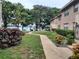 Peaceful walkway to lakefront condos with mature trees at 1181 Paseo Del Mar # D, Casselberry, FL 32707