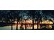 Stunning sunset view over a tranquil lake, enhancing the property's serene atmosphere at 1181 Paseo Del Mar # D, Casselberry, FL 32707