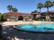 Inviting community pool with surrounding patio furniture at 1181 Paseo Del Mar # D, Casselberry, FL 32707