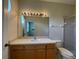 Bathroom with vanity, toilet and mirrored medicine cabinet at 10420 Kiplinger Ln # 238, Orlando, FL 32829
