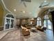 Community room with comfortable seating and access to kitchen at 10420 Kiplinger Ln # 238, Orlando, FL 32829
