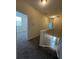 Upstairs hallway with carpet and access to bedrooms at 10420 Kiplinger Ln # 238, Orlando, FL 32829