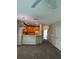 Living room with kitchen view, carpet, ceiling fan and access to other areas at 10420 Kiplinger Ln # 238, Orlando, FL 32829