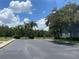 Community parking lot with lush landscaping at 10420 Kiplinger Ln # 238, Orlando, FL 32829