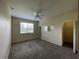 Spacious bedroom with carpeted floor and ceiling fan at 10420 Kiplinger Ln # 238, Orlando, FL 32829