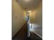 Upstairs hallway with carpet and access to bedrooms at 10420 Kiplinger Ln # 238, Orlando, FL 32829