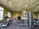 Fitness center featuring treadmills, weight machines, and mirrors at 10420 Kiplinger Ln # 238, Orlando, FL 32829